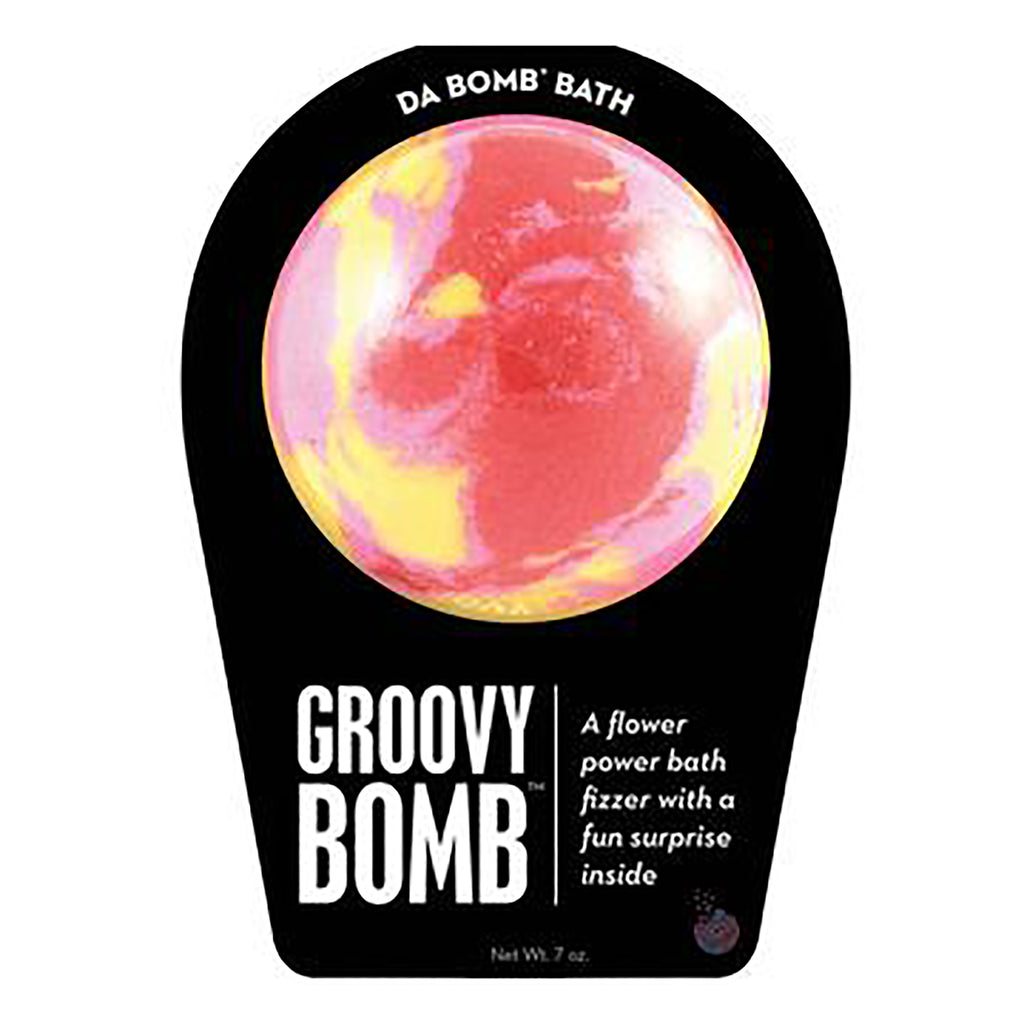 Da Bomb Groovy Bomb, red, pink and yellow swirled bath fizzer with floral scent and a surprise inside, in black clamshell packaging, front view.