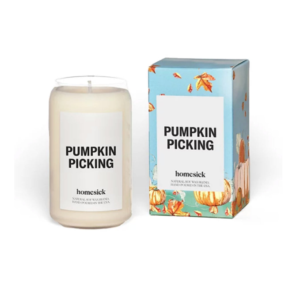 homesick pumpkin picking scented natural soy wax blend candle in glass vessel shaped like a can beside box with pumpkins in grass illustration.