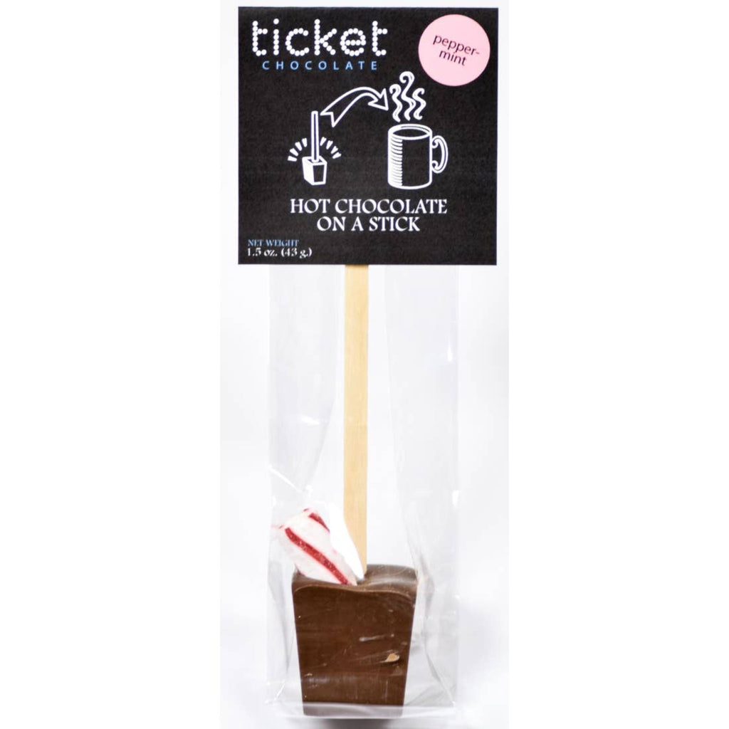 chocolate block on stick topped with peppermint stick in a cellophane bag with black card