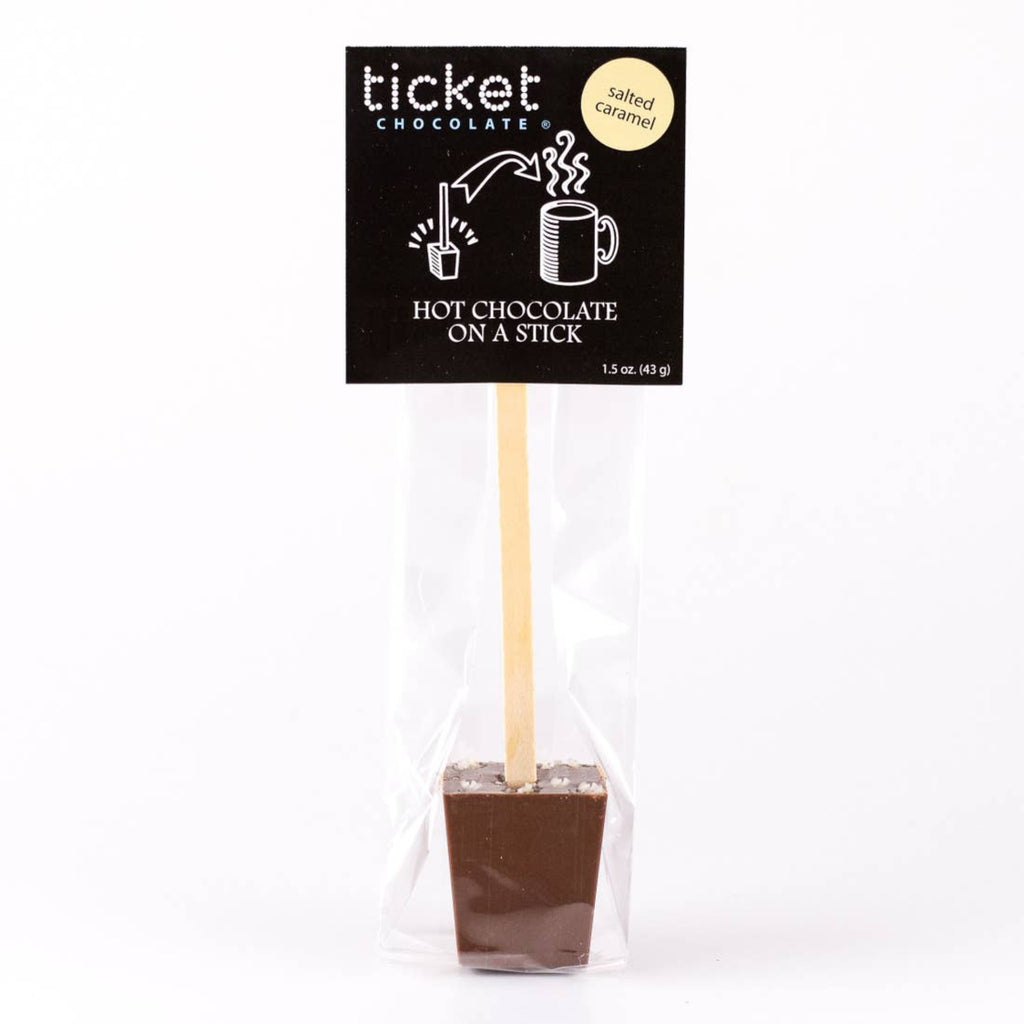 chocolate block on stick topped with sea salt in a cellophane bag with black card
