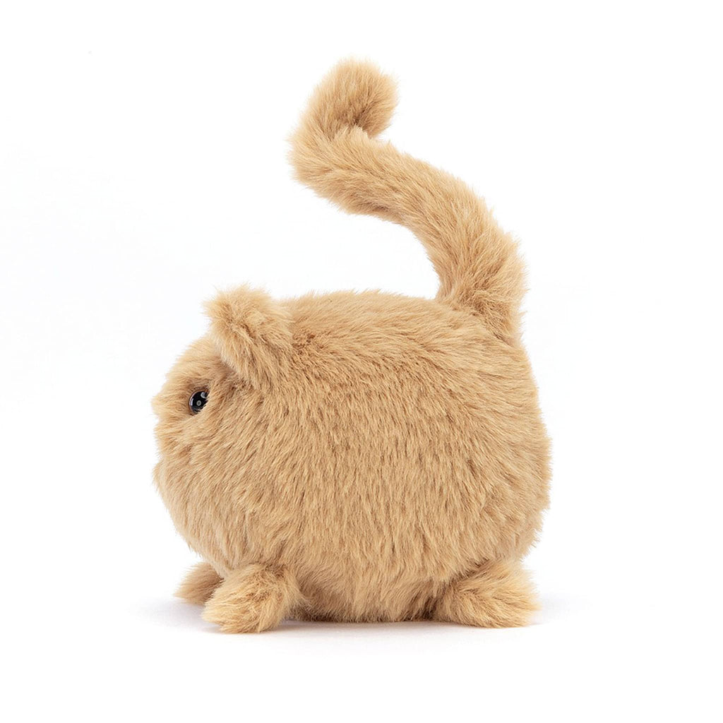 Ball shaped ginger kitten caboodle stuffie plush toy side view with brown eyes, pink nose, black mouth and a tail sticking straight up with a little curl at the end.