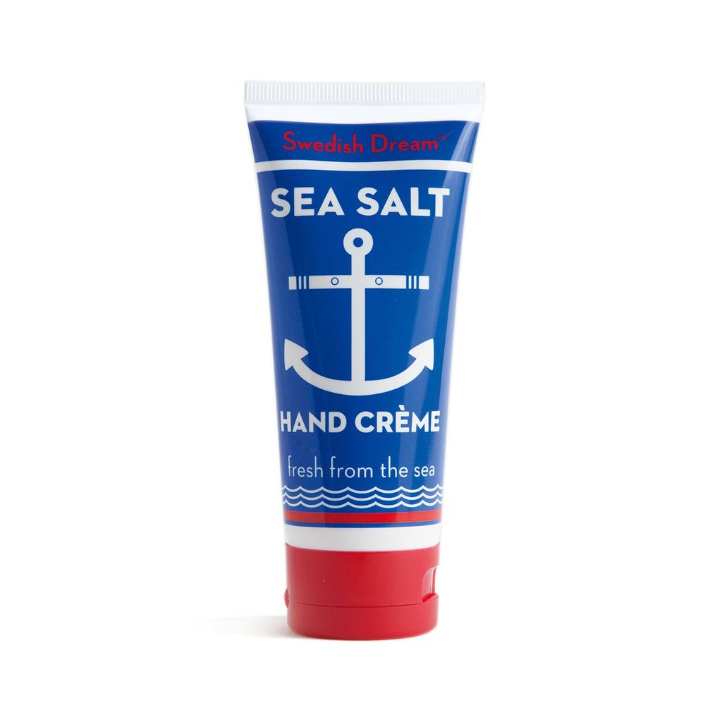 blue hand cream tube with "swedish dream" in red, "sea salt hand creme, fresh from the sea" in white, a white anchor and a red cap