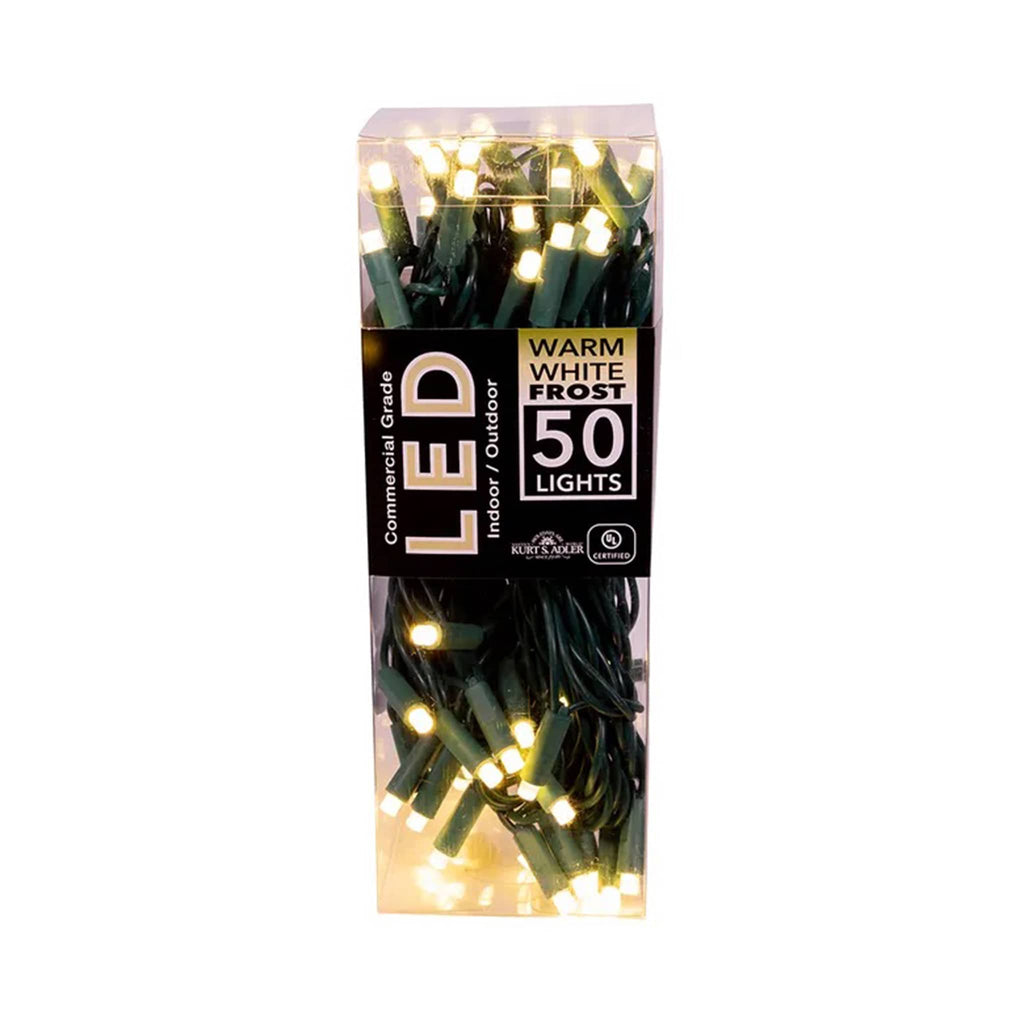 Set of 50 warm white frosted led string lights with green wire in clear plastic box packaging.