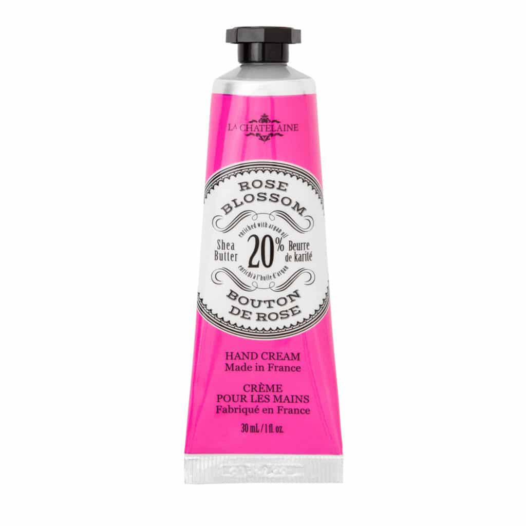 la chatelaine rose blossom scented shea butter luxe hand cream in tube with a bright pink label and black cap.