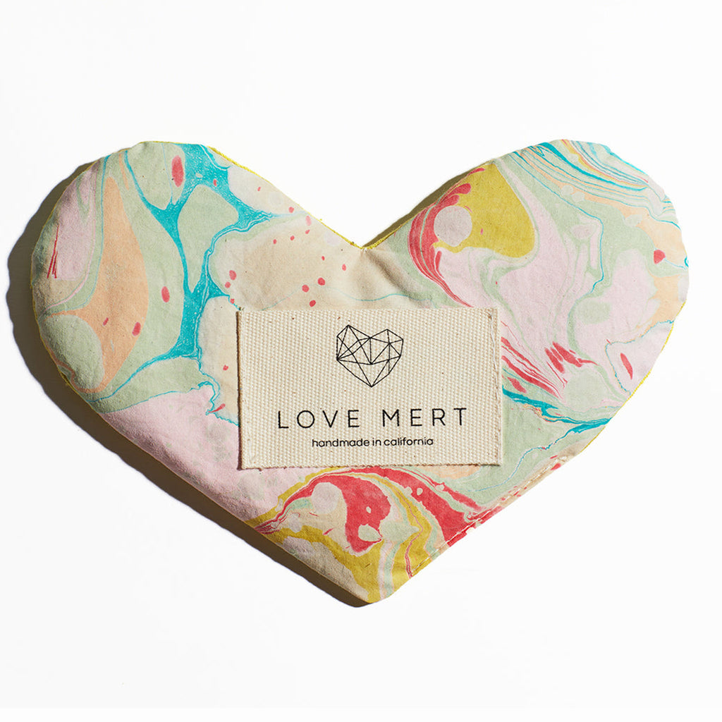 love mert heart shaped love eye pillow in pool color scheme with green, blue, pink, red and yellow swirls