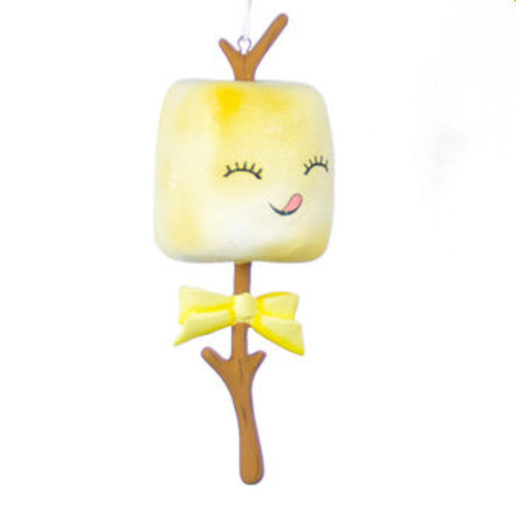 toasted marshmallow on branch with eyes closed and smiling mouth with tongue stuck out, wearing a yellow bow tie