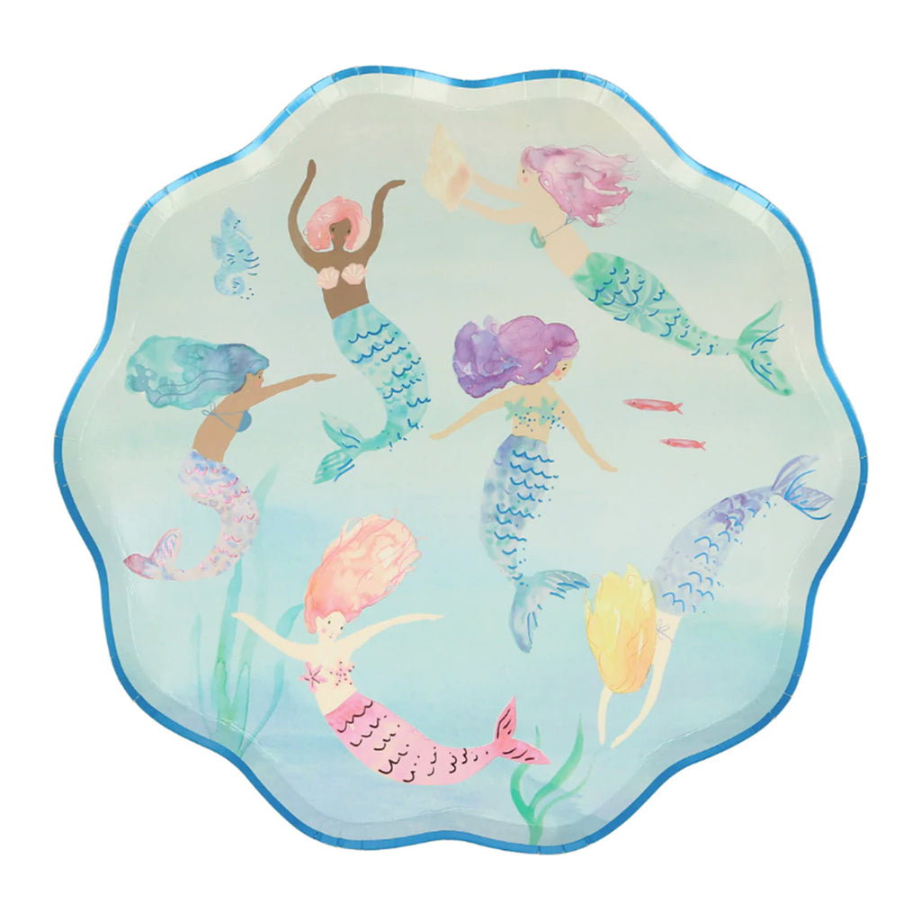 ombre blue paper plate with blue foil trimmed scalloped edges and 6 mermaids in varied colors swimming around with a blue seahorse, peach shell, pink fish and green seaweed at the bottom