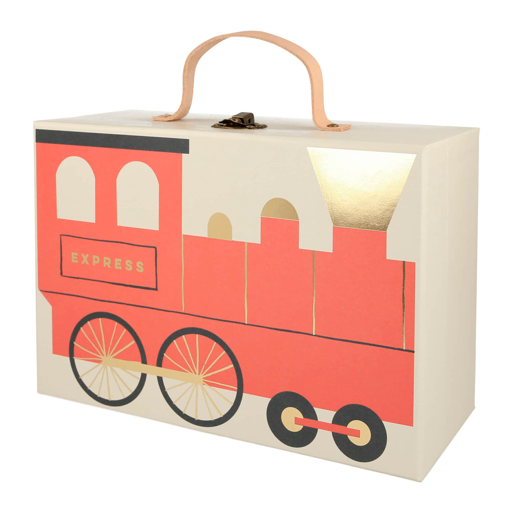 Railway train advent calendar, front of suitcase packaging with illustration of a red train engine and leather handle with brass clasp on top.