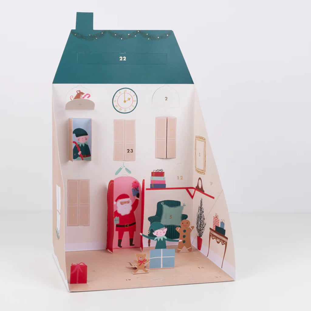 Meri Meri Santa's house pop up advent calendar front fully open with some of the paper characters revealed.