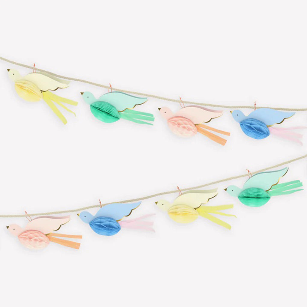 Meri Meri Honeycomb Bird Garland with yellow, green, pink and blue birds with honeycomb body and crepe paper embellishments, close-up.