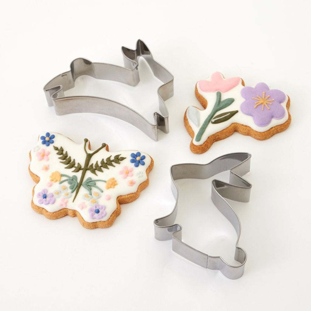 meri meri easter shaped stainless steel bunny, butterfly and flower cookie cutters with butterfly and flower finished cookies