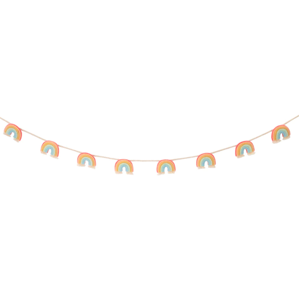 meri meri garland party decoration with individual rainbows made from coral, pink, dark yellow, mint green and pale blue with white fringe at the bottom strung on a white cotton cord