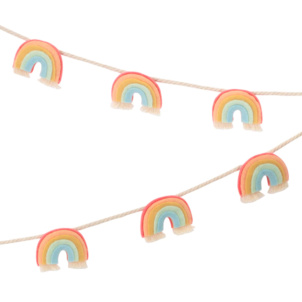 meri meri garland party decoration with individual rainbows made from coral, pink, dark yellow, mint green and pale blue with white fringe at the bottom strung on a white cotton cord detail shot