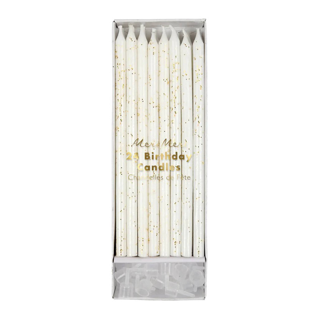 Pack of tall ivory party birthday cake candles with gold glitter in packaging with clear plastic holders.