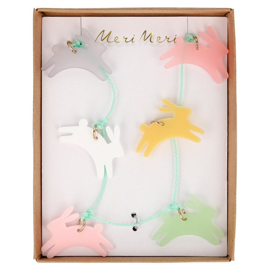 meri meri leaping bunny necklace with pink, green, yellow, pink and white acrylic bunny charms on a mint green cord