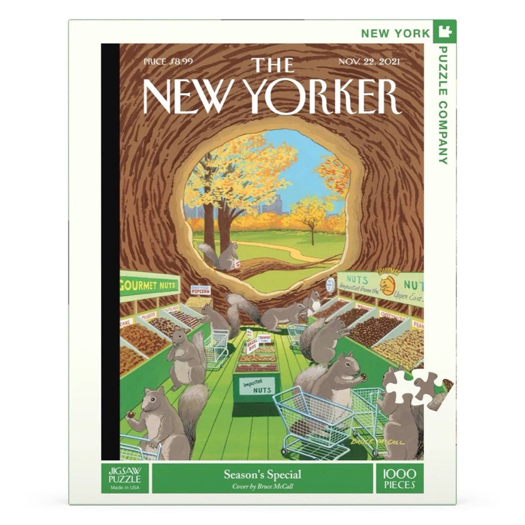 Front of box for a 1000 piece jigsaw puzzle of a New Yorker magazine cover of squirrels with shopping carts in a nut grocery store inside of a tree trunk with a view of trees with fall foliage and skyline in the background.