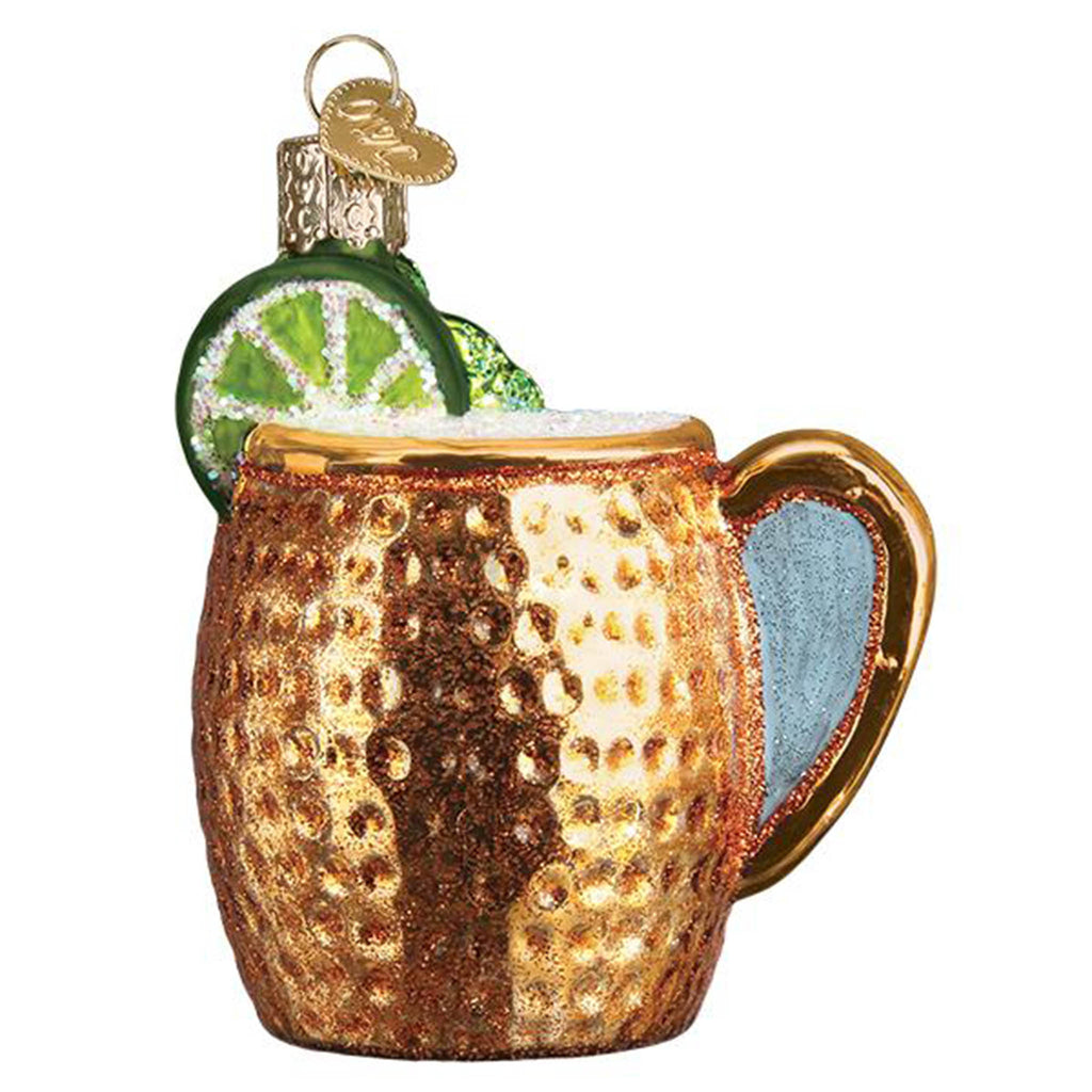 Front view of a glass holiday ornament that looks like a dimpled copper mug filled with a moscow mule drink and topped off with a lime.