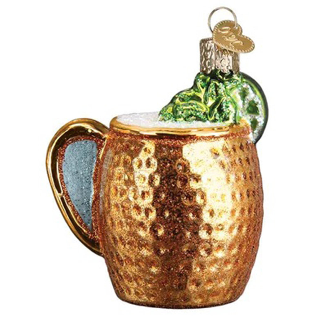 Back view of a glass holiday ornament that looks like a dimpled copper mug filled with a moscow mule drink and topped off with a lime.