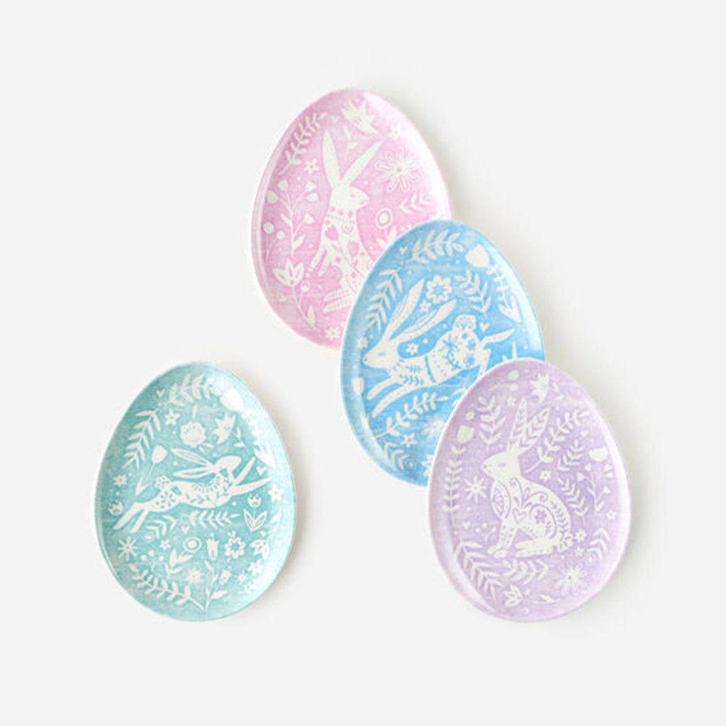 Egg shaped melamine plates with rabbit and floral designs in white on pastel green, pink, blue or purple background.