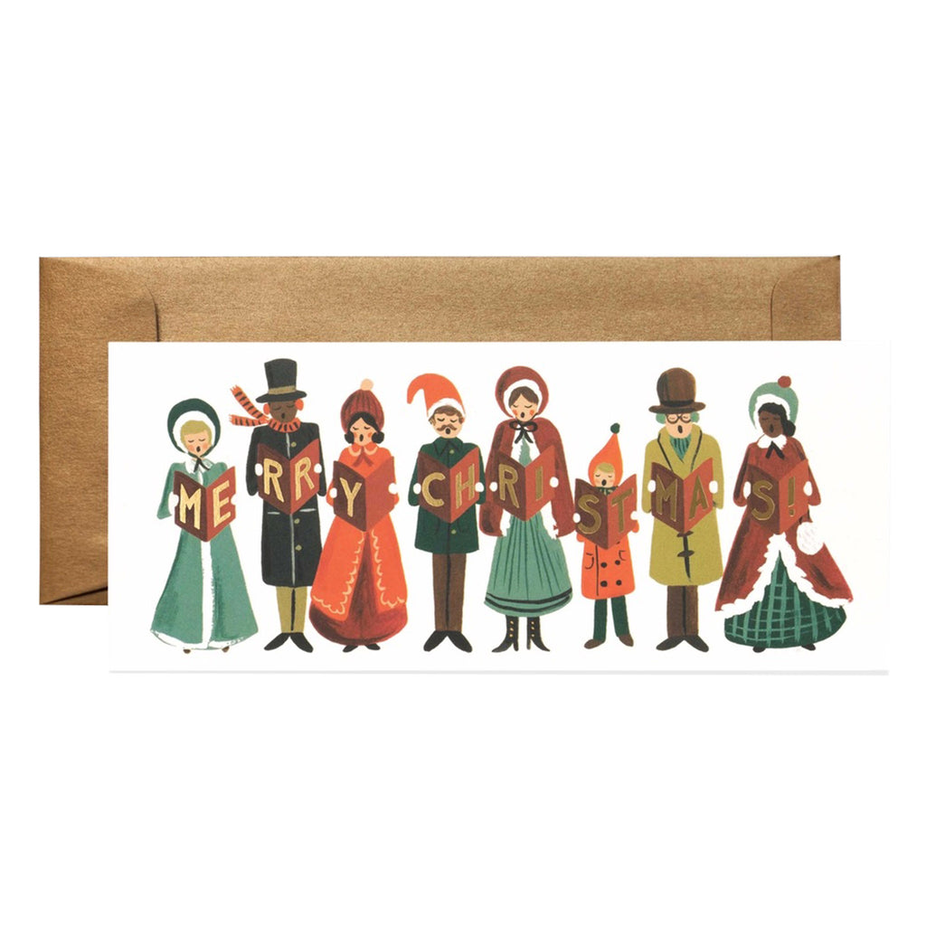 A row of carolers in winter clothing in green, red, black and gold holding songbooks that spell out "Merry Christmas" on the cover on a white rectangular card with matching metallic gold envelope.