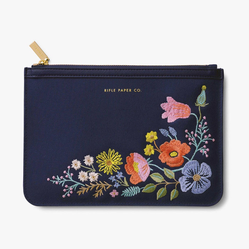 Rifle Paper Co dark blue zip clutch with their signature bramble pattern embroidered on the front with brass zip and logo engraved tag on the zip pull.
