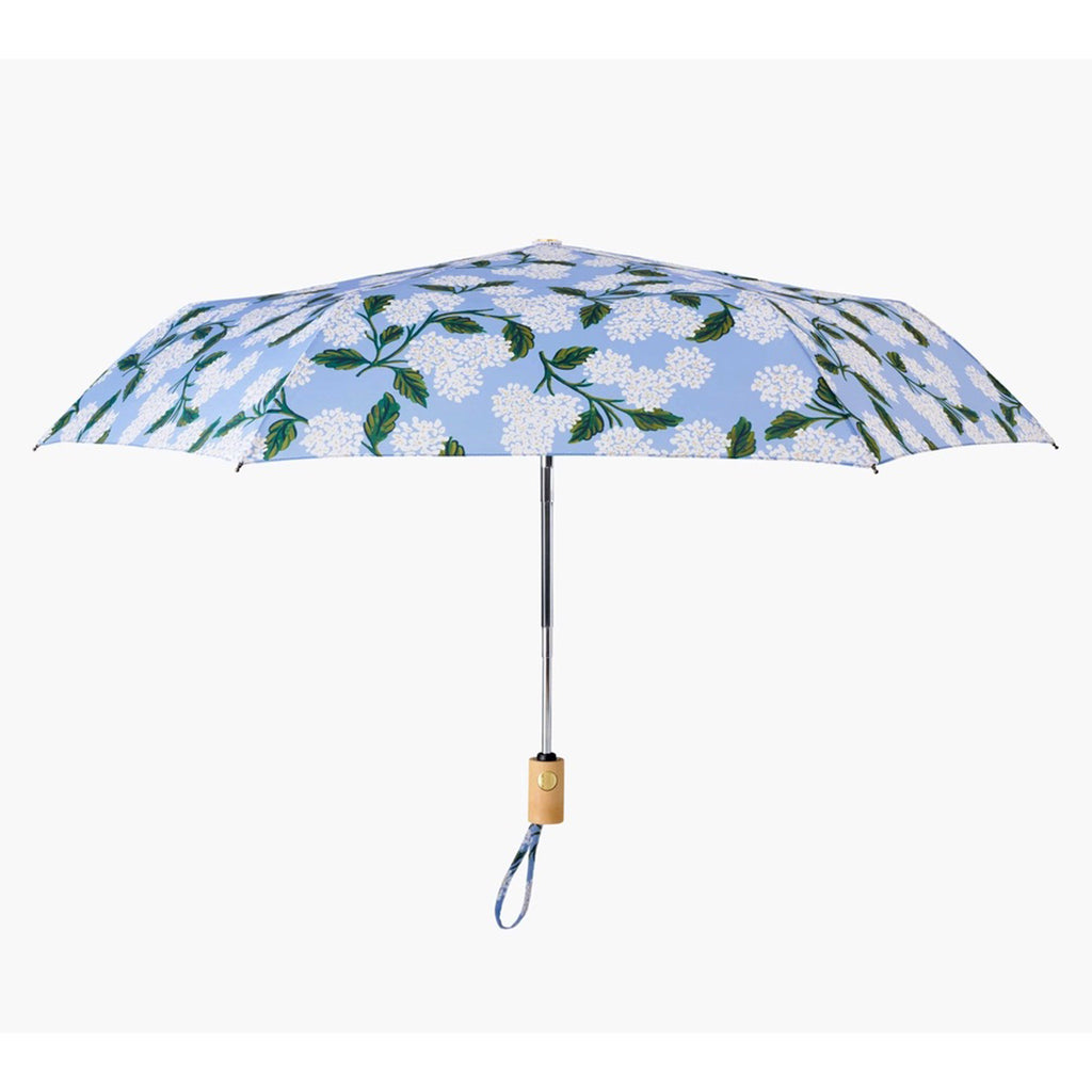 rifle paper company light blue umbrella with white hydrangeas and green leaves, open, side view