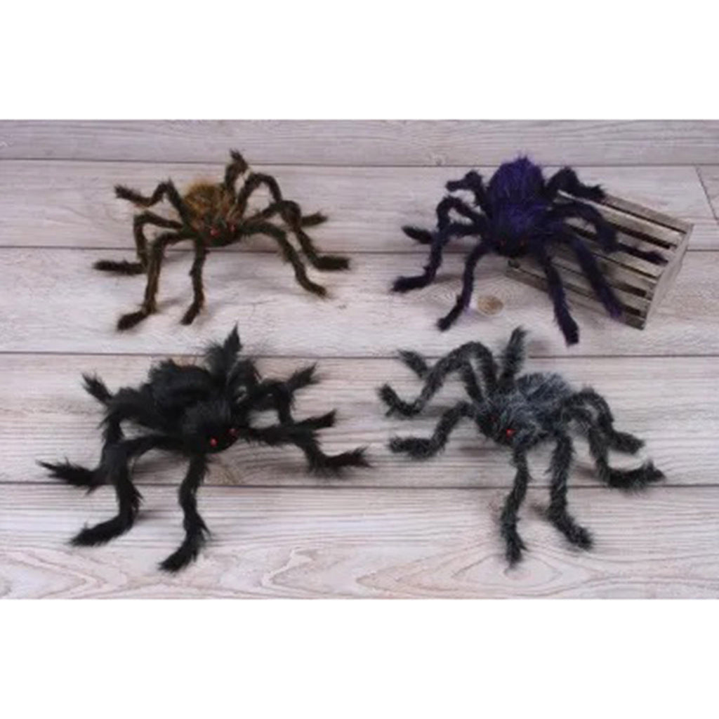 Giant posable hairy spiders in brown, purple, gray and black on a light wood background.