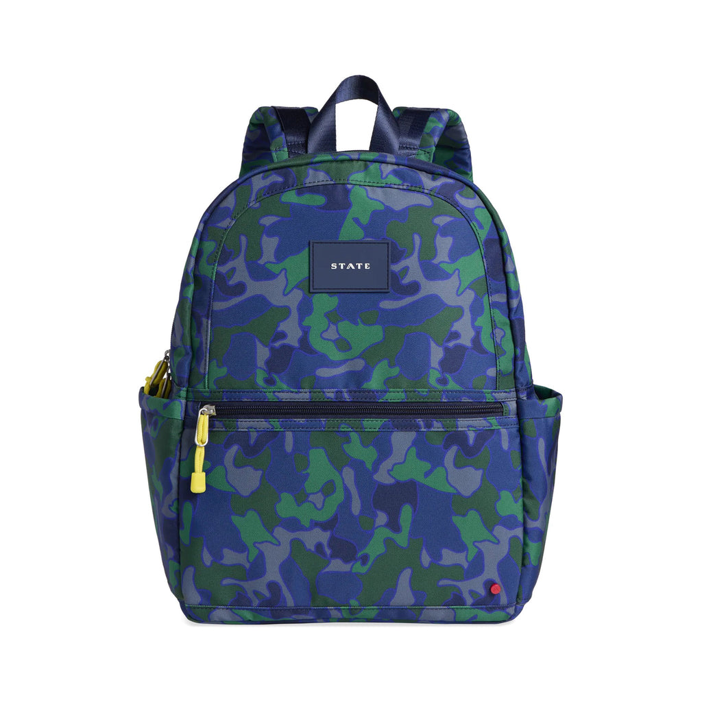kane small kids backpack with a blue and green camouflage print front view with yellow zipper pulls, shoulder straps and a navy top locker loop