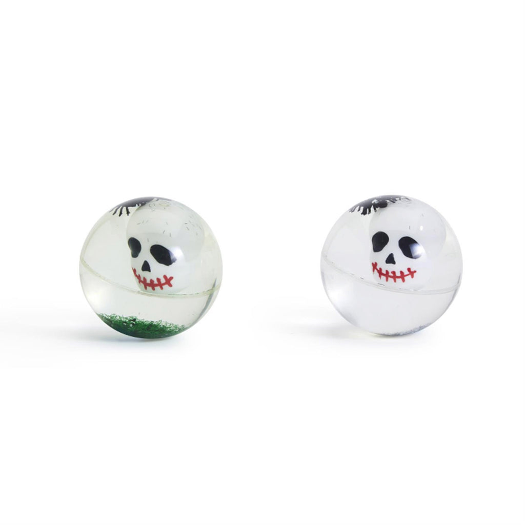 Front view of rubber bouncing balls with a skull, little black spiders and green or silver glitter.