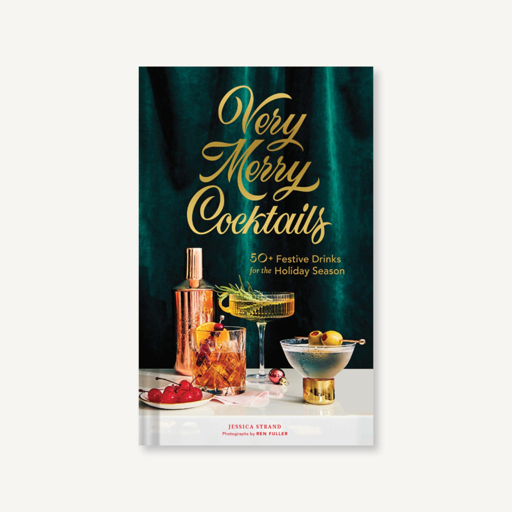 book cover with photograph of a cocktails shaker and cocktails with green velvet background and the words "very merry cocktails" in gold script