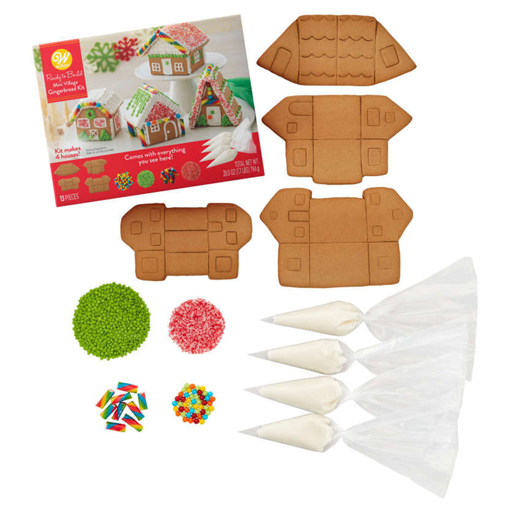 Wilton Ready-to-Build mini village gingerbread kit box front showing an example of the 4 finished houses you can build along with the contents included.