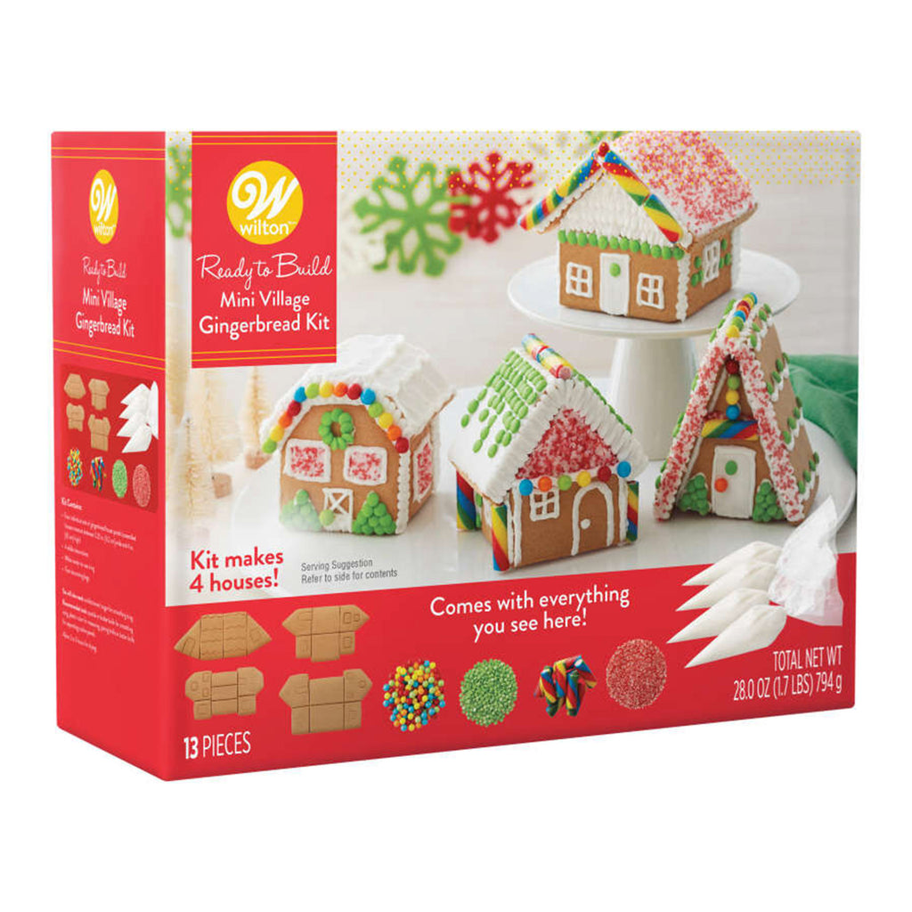 Wilton Ready-to-Build mini village gingerbread kit box front showing an example of the 4 finished houses you can build along with the contents included.
