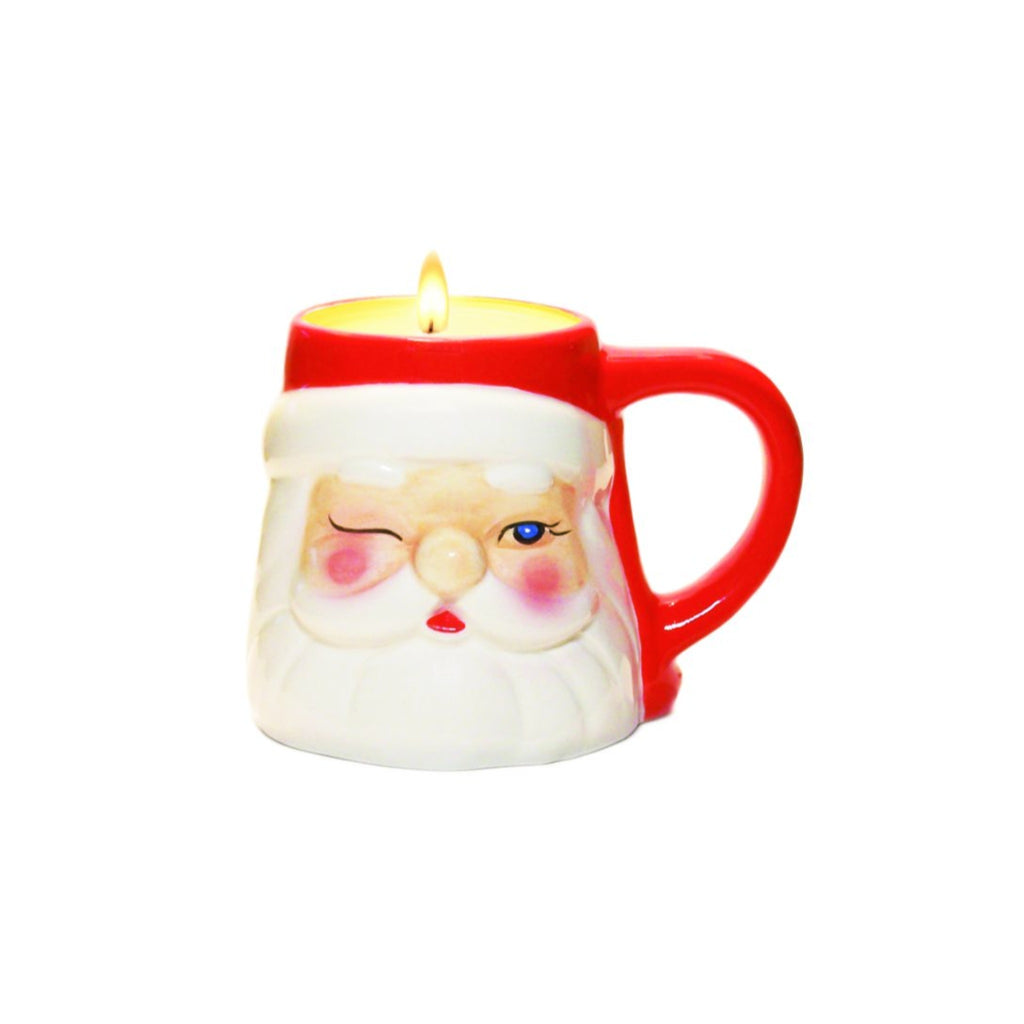 candle in a mini mug shaped like a winking santa head